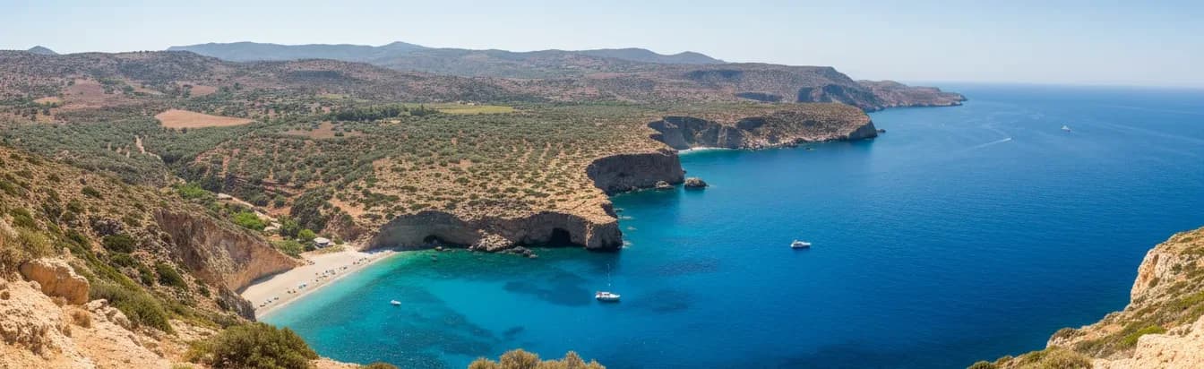 Aerial view of the Cretan coastline where dry hills meet deep turquoise sea